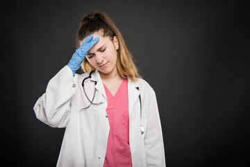 Young doctor portrait  making tired gesture