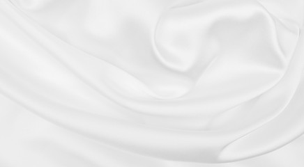 Naklejka premium Smooth elegant white silk or satin luxury cloth texture as wedding background. Luxurious Christmas background or New Year background design