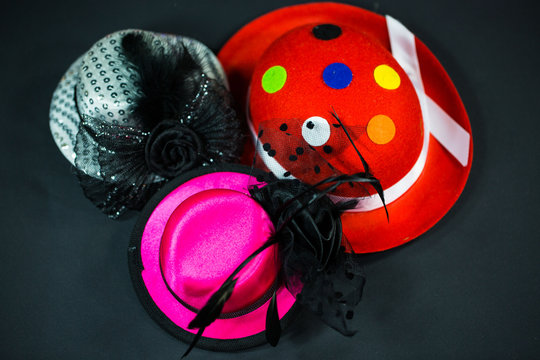 Hats on black background, carnival hats, party hats