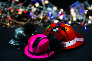 Hats on black background, carnival hats, party hats