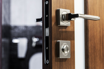 Fototapeta door handle and latch of brass on veneer doors obraz