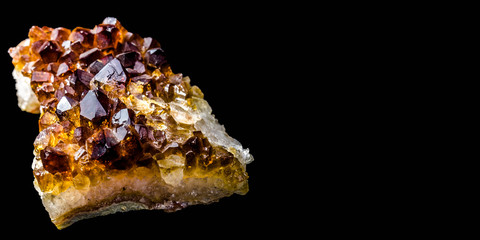 Stone with many crystals of quartz (smoke-quartz), isolated in front of black background with free space