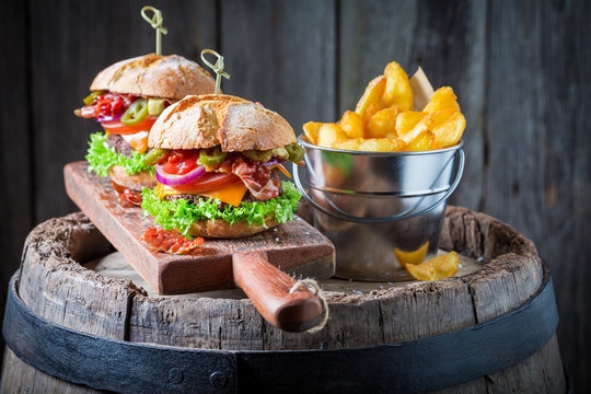 Hamburger made of beef, vegetables and cheese with chips