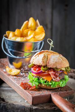 Closeup of delicious hamburger made of onion, tomato and lettuce