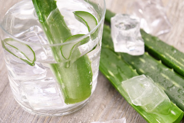 Macro of Slices of Aloe Vera with water drops and aloe gel very useful herbal medicine for skin care and hair care.