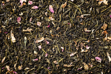 Background with green tea, robinia and rose blossom with copy space. Top view.