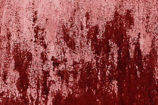 Rusty metal wall texture in red tone.