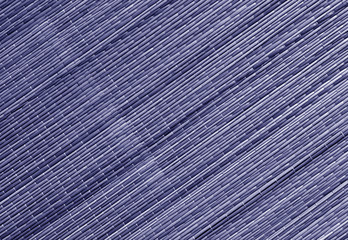 Blue toned straw mat surface.