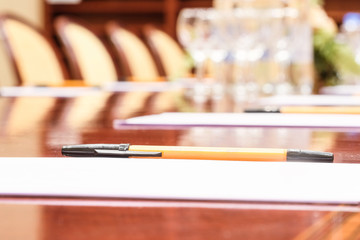 Pen and the paper on a table