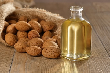 Almond oil composition used for cosmetics, spa, wellness centers. Perfect body oil and moisturizing skin. Concept of: beauty, oils, creams, wellness.