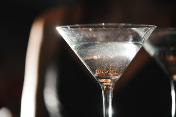 A martini glass with a ring