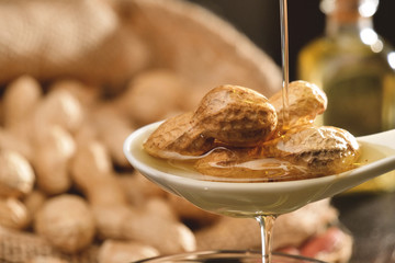 Composition of peanuts serving to make oil, peanut butter. Great for healthy and dietary nutrition. Concept of: condiments, dried fruit, food.