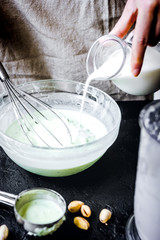 organic ice cream homemade process on dark background with hands