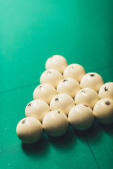 green gambling table with balls for russian pool