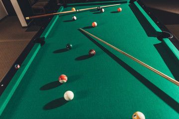 billiard gambling table with cues and balls