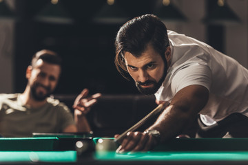 handsome caucasian man playing in snooker - obrazy, fototapety, plakaty