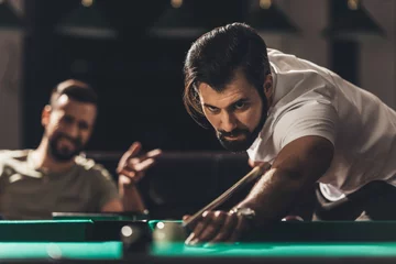 Foto op Plexiglas handsome caucasian man playing in snooker © LIGHTFIELD STUDIOS