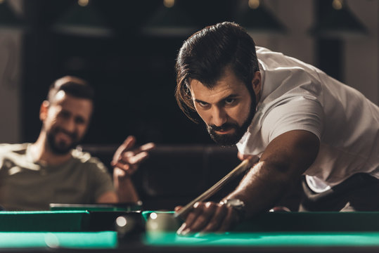 handsome caucasian man playing in snooker