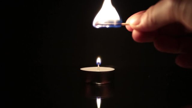 candle flame against black background
