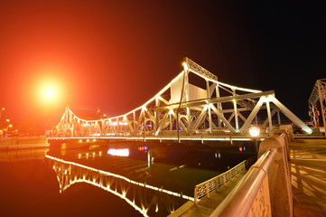 The modern city highway Bridges night landscape car light trails arc in tianjin