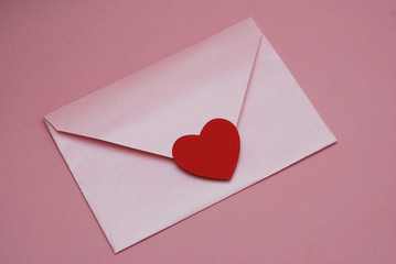 Valentine's or Mother Woman day. Background with Pink Envelope with Red Paper Heart, on Pink Background.