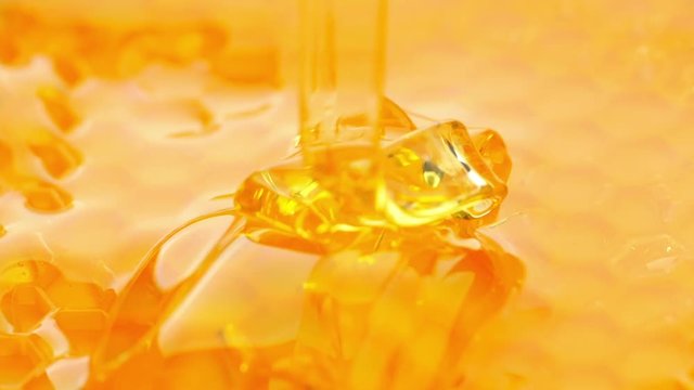 Pouring honey on honeycomb