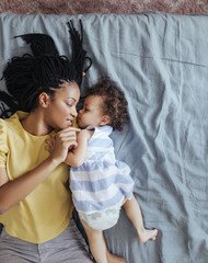 Mother Cuddling Her Baby