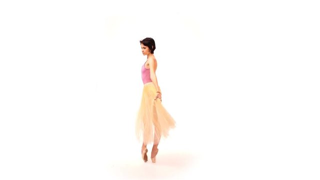 ballerina is dancing in the studio on a white cyclorama