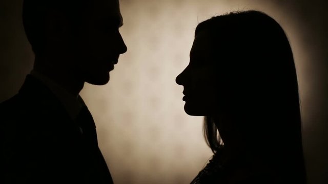 Silhouettes of man and woman