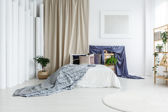 Grey and patterned blankets