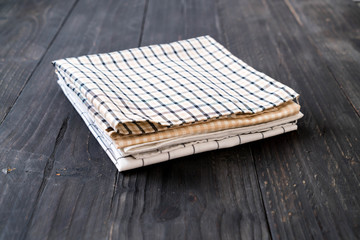 kitchen cloth (napkin) on wood background