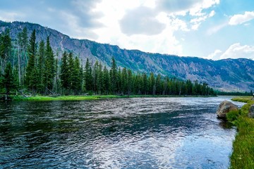 Obraz na płótnie Canvas The Beautiful Firehole River that runs through Yellowstone National Park what stunning scenery.