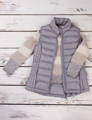 Down vest and woolen sweater