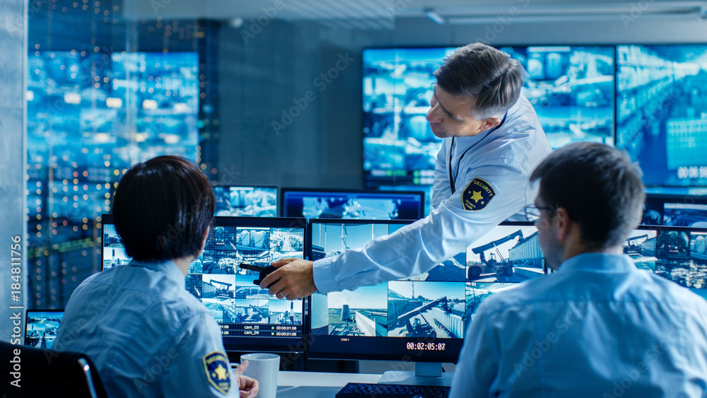 Aufkleber in the security control room chief surveillance officer showing on screen a crime for two of his sub