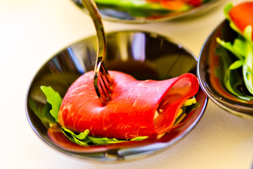 Italian aperitif, bresaola roll with fresh cheese