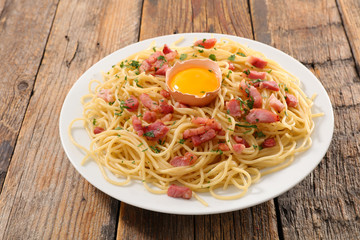 carbonara spaghetti on wood background