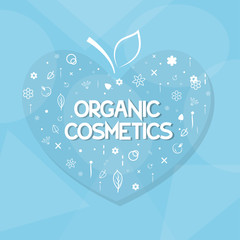 organic cosmetics and herbs in the shape of heart on a blue background