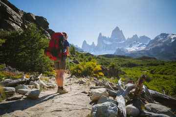 Young woman is admiring the view of Fitz Roy in Patagonia region in Argentina