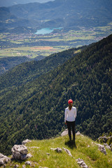 Young female is admiring majestic views with lake Bled in the distance in Slovenia