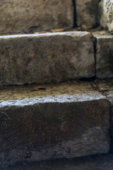 Scalded stairs of an old rural house lit by sunlight.