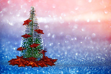Christmas Tree with glitter background and bokeh effect