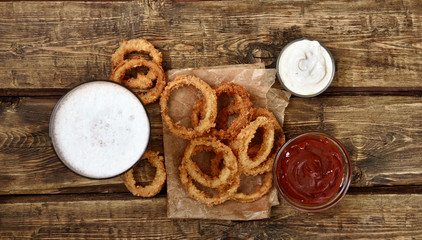 Fototapeta premium Fried onion rings, top view