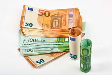 Euro money bank. Rolled up Euro bills on white background. One hundred and 50 Euro bills
