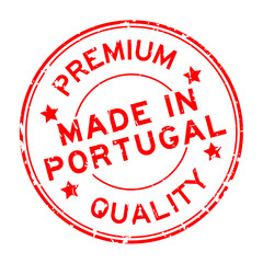 Grunge red premium quality made in Portugal round rubber seal stamp on white background
