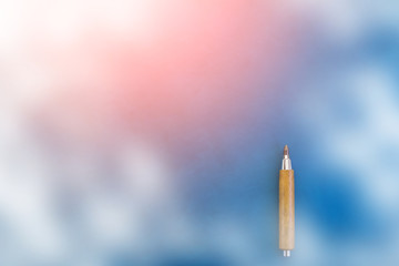 pencil on blue color backgreound with free copyspace for your creativity ideas text and smoke filter effect