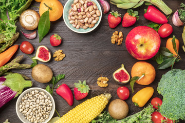 Vibrant fresh vegetables, fruits, and legumes with copy space
