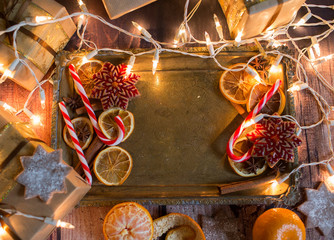 Christmas background with lights, ornaments, candy and decorations. Free space