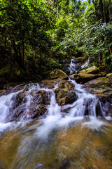 Fototapeta premium Kathu waterfall in a tropical forest. Phuket, Thailand