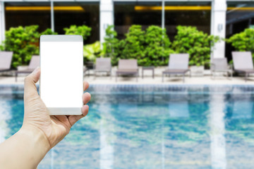 hand hold smartphone Swimming pool with stair and tree