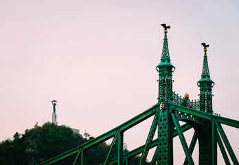 Hungary, Budapest, part of the green Liberty bridge. European old city bridge exterior, liberty statue on the background.
